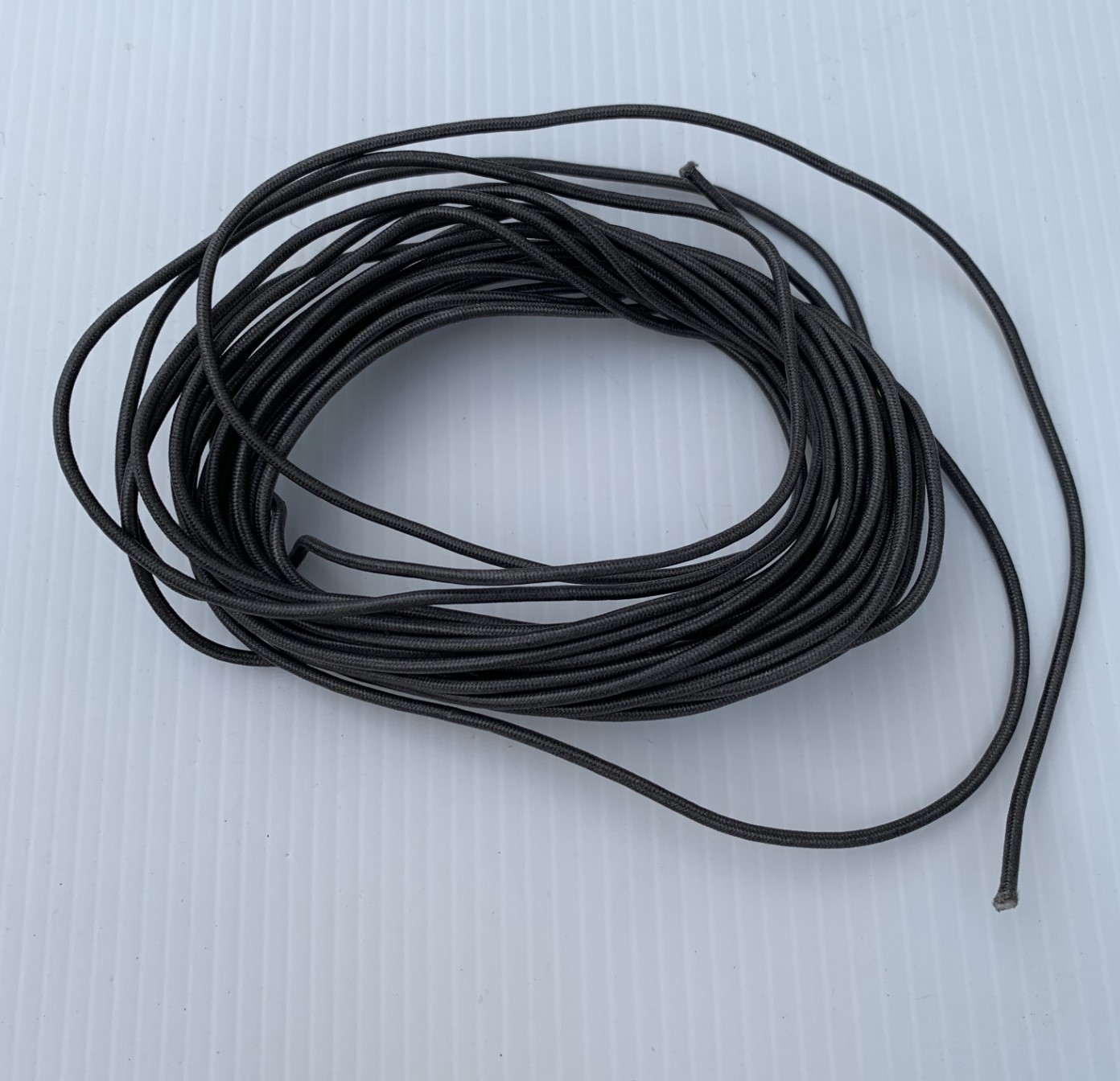 Loosely coiled length 3.3 metre of 1/16th diameter spectra rudder cord